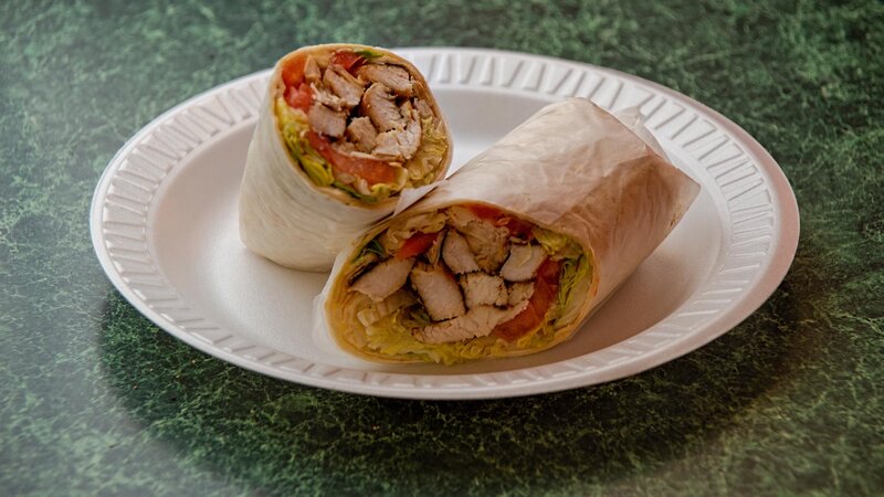 Grilled chicken wrap with lettuce and tomato