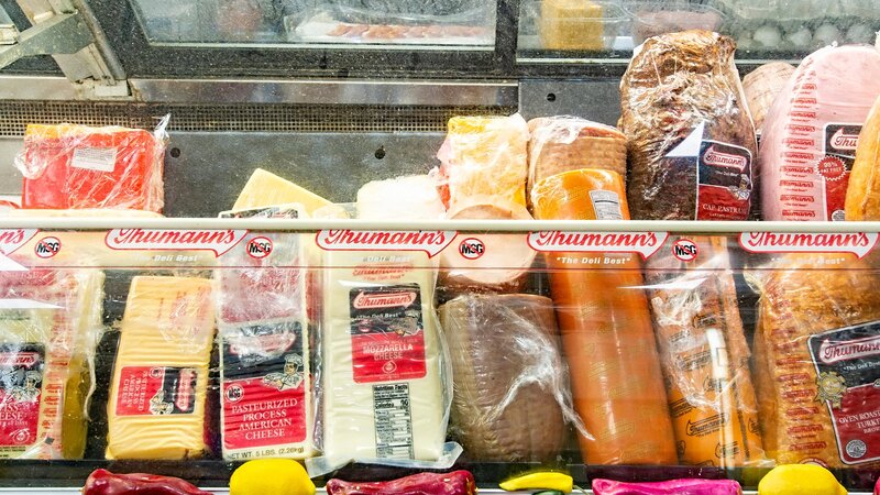 Thumann's deli meats and cheeses inside of a display case
